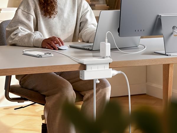 Power strip charging a home office setup