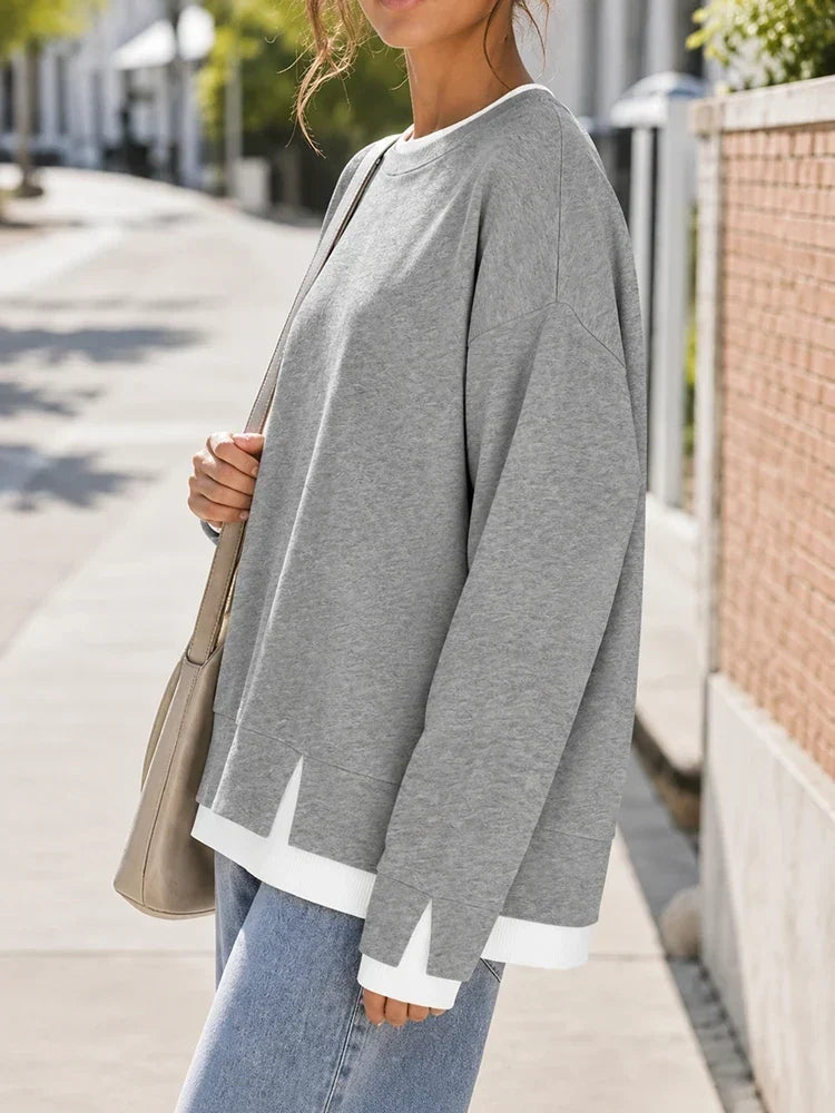Side view showing layered hem and drop shoulder